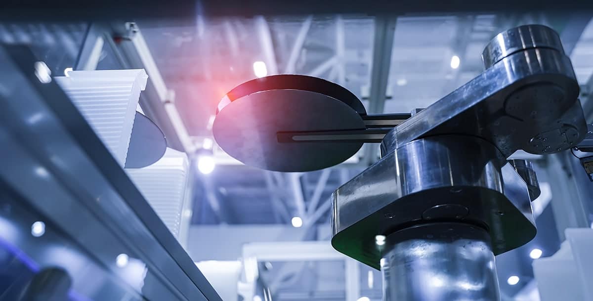 A semiconductor wafer holder from a below perspective as it moves along the manufacturing process