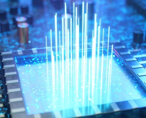 A large square on a circuit board with a blue color overlay. Beams of light of varying heights are coming up from the center of the square